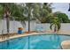 Refreshing pool area with palm trees and lounge chairs for soaking up the sun at 12299 91St N Ave, Seminole, FL 33772