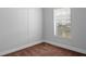 Bedroom featuring white walls, tan carpet, and white trim at 12720 Four Oaks Rd, Tampa, FL 33624