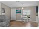 Living room features wood floors, neutral paint, furniture, and a window with natural light at 12720 Four Oaks Rd, Tampa, FL 33624