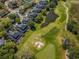 Overhead shot of townhomes next to golf course, pond, and green space at 1335 Lahara Way, Trinity, FL 34655