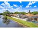 Aerial view of a home with a screened-in pool, surrounded by a white picket fence at 16843 Harrierridge Pl, Lithia, FL 33547