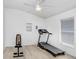 A versatile room that can be used as a home gym with laminate floors and bright natural light at 16843 Harrierridge Pl, Lithia, FL 33547