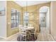 Charming breakfast nook with a round table, window, and stylish chandelier lighting at 16843 Harrierridge Pl, Lithia, FL 33547