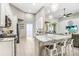 Open-concept kitchen featuring a spacious island, stainless steel appliances, and seamless flow to living area at 16843 Harrierridge Pl, Lithia, FL 33547