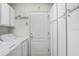 Laundry room with washer, dryer, cabinets, and tiled floors at 16843 Harrierridge Pl, Lithia, FL 33547