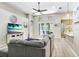 Bright and inviting living room with modern décor, ample natural light, and seamless access to the outdoor patio at 16843 Harrierridge Pl, Lithia, FL 33547