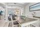 Open-plan living area with wood floors that connect to a large outdoor deck and pool at 16843 Harrierridge Pl, Lithia, FL 33547