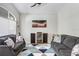 Cozy living room area featuring vaulted ceilings, a ceiling fan, and plush seating at 16843 Harrierridge Pl, Lithia, FL 33547
