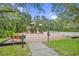 Community playground featuring slides and play structures at 16843 Harrierridge Pl, Lithia, FL 33547