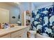Functional bathroom with a shower and tub, vanity, and built-in shelving for storage at 17965 Villa Creek Dr, Tampa, FL 33647