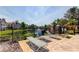 Comfortable chaise lounges near a gated pool area with scenic views of the pond at 17965 Villa Creek Dr, Tampa, FL 33647