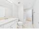 Well-lit bathroom with double sinks, tile flooring, and a shower/tub combination at 1810 E Palm Ave # 6104, Tampa, FL 33605