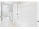 Bright bathroom with a view from the shower to the toilet and sink, plus the doorway out to the bedroom at 1810 E Palm Ave # 6104, Tampa, FL 33605