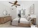 Nicely decorated bedroom featuring a ceiling fan, accent furniture, artwork, and curtains at 1810 E Palm Ave # 6104, Tampa, FL 33605