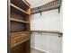 Organized walk-in closet featuring built-in shelving, hanging racks, and ample storage space for clothing and accessories at 1810 E Palm Ave # 6104, Tampa, FL 33605