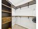 Walk-in closet features built-in shelving, hanging racks, and ample storage space for clothing at 1810 E Palm Ave # 6104, Tampa, FL 33605