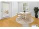 Staged dining room with a round table, chairs, and a decorative plant, creating an inviting space at 1810 E Palm Ave # 6104, Tampa, FL 33605
