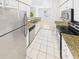 Kitchen with stainless steel appliances, granite countertops, and ample cabinet space at 1810 E Palm Ave # 6104, Tampa, FL 33605
