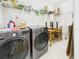 Laundry room with stainless steel washer and dryer, wire shelving and tile flooring at 1810 E Palm Ave # 6104, Tampa, FL 33605