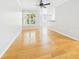 Bright, empty living room with hardwood floors and large windows offering ample natural light at 1810 E Palm Ave # 6104, Tampa, FL 33605