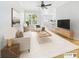 Staged living room with modern furniture, a large window, and stylish decor for a cozy atmosphere at 1810 E Palm Ave # 6104, Tampa, FL 33605