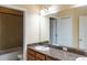 Bathroom featuring a vanity with granite countertop, modern faucet, and vanity mirror at 19227 Stone Hedge Dr, Tampa, FL 33647