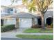Charming townhome featuring a two-car garage and beautifully maintained landscaping at 19279 Stone Hedge Dr, Tampa, FL 33647