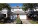 A charming townhome featuring a two-car garage and beautiful stone accents at 19279 Stone Hedge Dr, Tampa, FL 33647