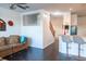 Open-concept living space with dark hardwood floors and views of the staircase at 19279 Stone Hedge Dr, Tampa, FL 33647