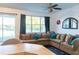 Comfortable living room featuring a large window and view of the lake at 19279 Stone Hedge Dr, Tampa, FL 33647