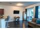 Open-concept living space with access to the patio at 19279 Stone Hedge Dr, Tampa, FL 33647