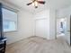 Bright bedroom with ceiling fan, window, and a double closet at 20352 Falling Rock Dr, Land O Lakes, FL 34638