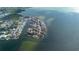 Scenic aerial view of a coastal neighborhood, featuring waterfront homes with private boat docks and ocean access at 3192 Gulf Winds Cir, Hernando Beach, FL 34607