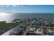 Panoramic aerial view of waterfront homes with backyard docks, offering stunning water access and views at 3192 Gulf Winds Cir, Hernando Beach, FL 34607