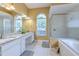 Spacious bathroom featuring double sinks, granite countertops, and walk-in shower at 3217 Partridge Point Trl, Valrico, FL 33596