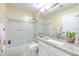 Bathroom featuring tub, granite vanity and ample lighting at 3217 Partridge Point Trl, Valrico, FL 33596