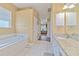 Bathroom featuring a soaking tub, walk-in shower, and granite countertops at 3217 Partridge Point Trl, Valrico, FL 33596