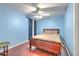 Bedroom with ceiling fan and wooden floors at 3217 Partridge Point Trl, Valrico, FL 33596