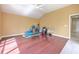 Expansive bonus room featuring hardwood floors and a vaulted ceiling, perfect for flexible living at 3217 Partridge Point Trl, Valrico, FL 33596