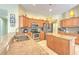 Close-up of granite countertops, stainless appliances, and kitchen island at 3217 Partridge Point Trl, Valrico, FL 33596