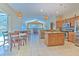Spacious open kitchen with granite countertops, stainless steel appliances, and adjacent dining area at 3217 Partridge Point Trl, Valrico, FL 33596