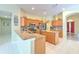 Granite countertops, stainless appliances, tile backsplash, and kitchen island at 3217 Partridge Point Trl, Valrico, FL 33596