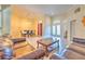 Open living space with tile floors, view of the dining room, and a well-lit entryway at 3217 Partridge Point Trl, Valrico, FL 33596