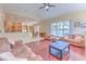 Expansive living area with hardwood floors, a kitchen view, dining area, and lots of seating at 3217 Partridge Point Trl, Valrico, FL 33596