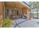 Spacious patio with outdoor kitchen and seating area overlooking the pool at 3217 Partridge Point Trl, Valrico, FL 33596