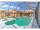 Inviting pool and spa with covered lanai and lush landscaping at 3217 Partridge Point Trl, Valrico, FL 33596