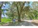 Scenic view of Zeina Park, featuring mature trees, lush greenery, and recreational facilities, perfect for community enjoyment at 3217 Partridge Point Trl, Valrico, FL 33596