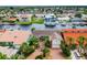 Aerial view of the house with a brick driveway, landscaping, and waterfront access at 3545 Seaway Dr, New Port Richey, FL 34652