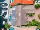 Aerial view of a house with a pool, spa, boat dock, and waterfront access at 3545 Seaway Dr, New Port Richey, FL 34652