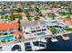 Aerial view of a neighborhood home with a private pool, spa, and dock on the water at 3545 Seaway Dr, New Port Richey, FL 34652